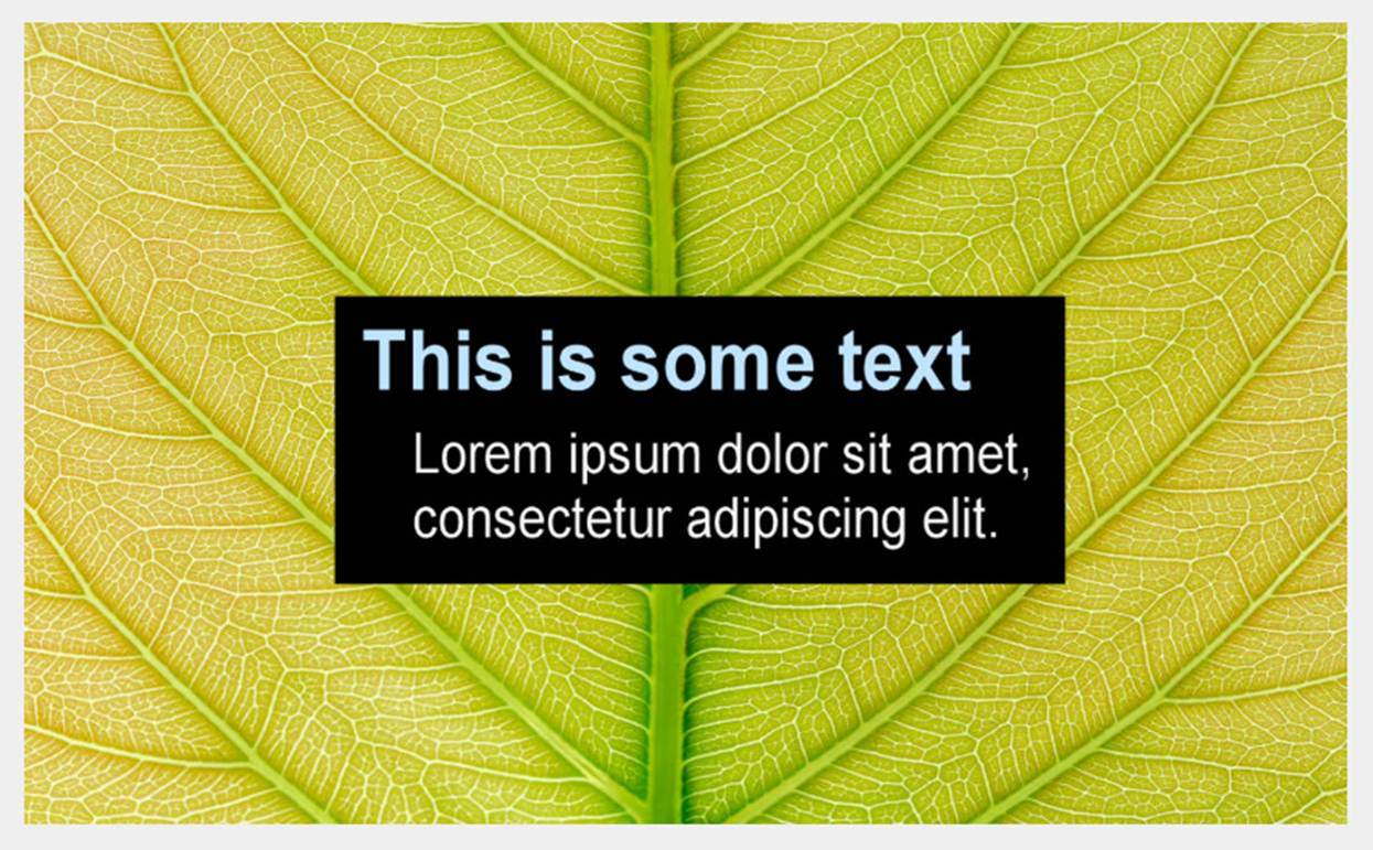 A close up of a light green leaf with white text which has a contrasting black background.